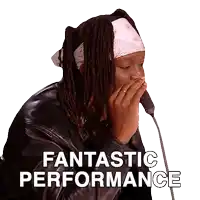 a man with dreadlocks is covering his mouth with his hand and the words fantastic performance are below him