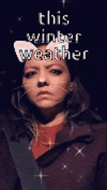 a woman wearing a cat ear mask with the words this winter weather written above her