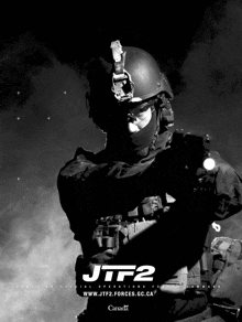 a black and white photo of a soldier with the words jtf2 on it