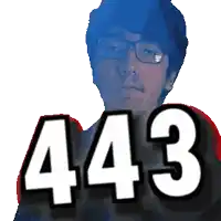 a man with glasses and the number 443 on his chest
