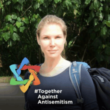 a woman with a backpack is standing in front of a sign that says together against antisemitism