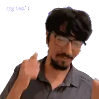 a pixelated image of a man wearing glasses and giving a thumbs up