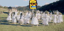 a pixelated image of a group of people dancing in a field