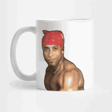 a man with a red bandana on his head is on a coffee mug