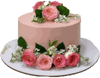 a pink cake with roses and baby 's breath on it