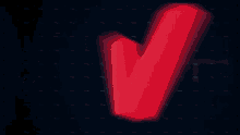 a red letter v that is glowing in the dark