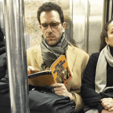 a man is reading a book titled " how to sell children one way "