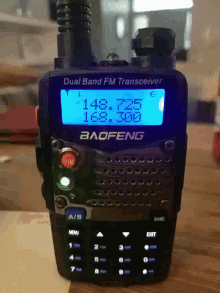 a baofeng dual band fm transceiver is on a table