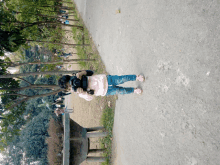 a person taking a picture with a camera on a path