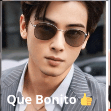 a picture of a man wearing sunglasses with que bonito written below him