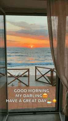 a picture of a sunset over the ocean with the words " good morning my darling have a great day "