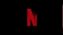 the netflix logo is red and glowing in the dark .