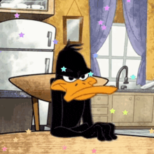 a cartoon of daffy duck sitting at a table
