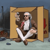 a man in a suit is sitting in a cardboard box holding a can of soda