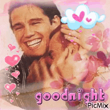 a picture of a man hugging a woman with the words goodnight written on it .