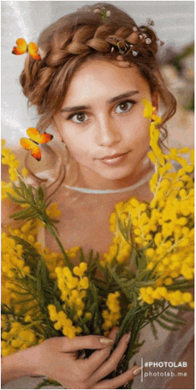 a woman is holding a bouquet of yellow flowers and has a braided hairdo