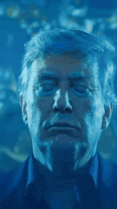 a close up of donald trump 's face with his eyes closed in a dark room