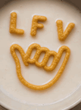 the letters lfv are drawn on a white plate