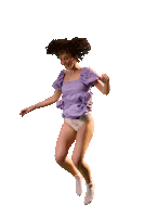 a woman in a purple dress and white underwear jumping in the air