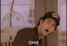 a man wearing a hat with the word ohh on it