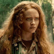 a close up of a woman with red hair