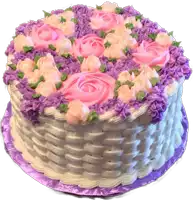 a basket shaped cake with pink and purple flowers on it