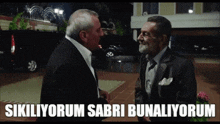 two men in suits are standing next to each other with the words " sikiliorum sabri bunaliorum " on the bottom