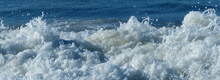 a large body of water with a lot of foam on it