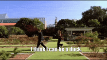 a man and woman walking in a park with the words " i think i can be a duck "