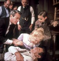 A BIG HAND FOR THE LITTLE LADY, foreground: Kevin McCarthy (left), Joanne Woodward (top), Henry Fonda (on ground), Jean-Michel Michenaud (right), background: John Qualen (watch chain), 1966