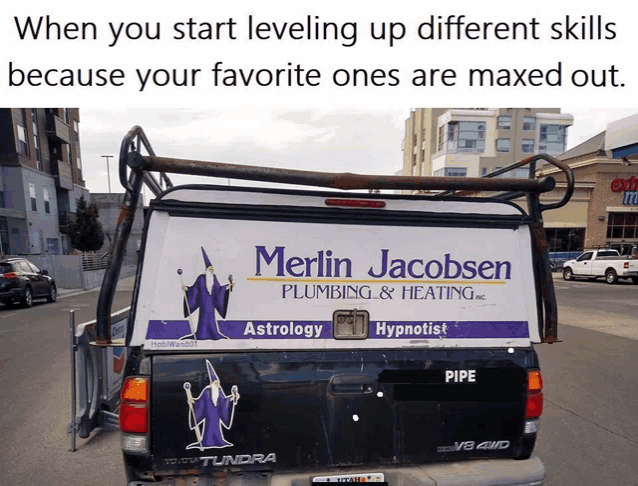 a truck with a merlin jacobsen plumbing and heating advertisement