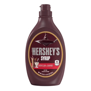 a bottle of hershey 's special dark syrup with a spoon in it