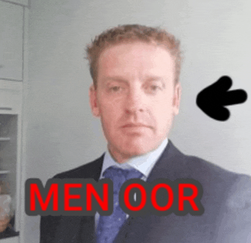 a man in a suit and tie with the word men oor written on his face