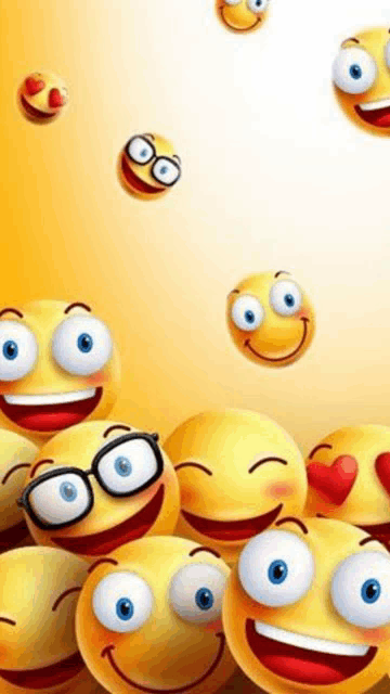 a bunch of smiley faces are floating in the air on a white background .