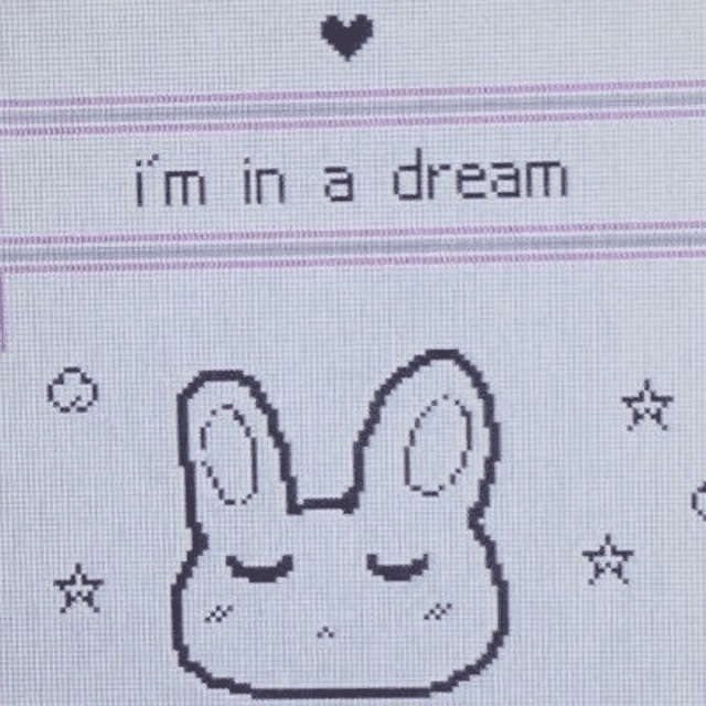 a pixel art of a bunny with the words `` i 'm in a dream '' written on it .