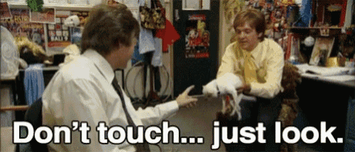 two men are sitting in a room with the words " don 't touch ... just look " written on the bottom
