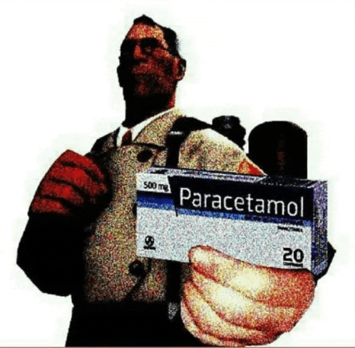 a man holds a box of paracetamol in his hand