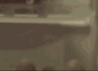 a close up of a person 's back with a dark background .