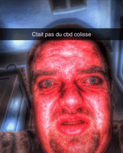 a man with a red face and the words ctait pas du cbd colisse above him