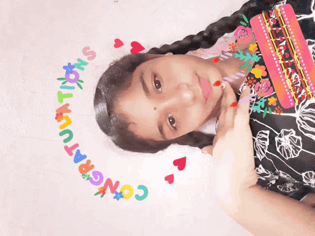 a girl with congratulations written on her face
