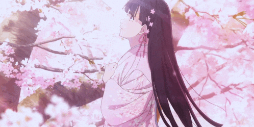 a girl in a pink kimono is standing in front of a tree with pink flowers