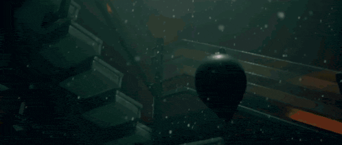 a man wearing a black shirt with the letters aa on the back