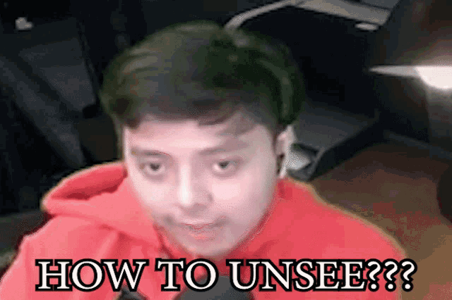 a man in a red hoodie with the words how to unsee on the bottom