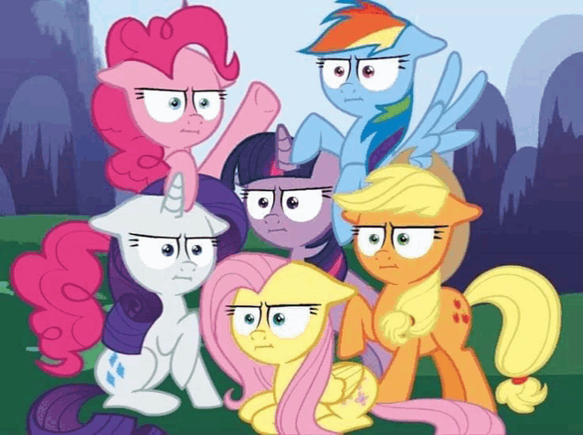 a group of ponies with angry faces are standing next to each other in a field