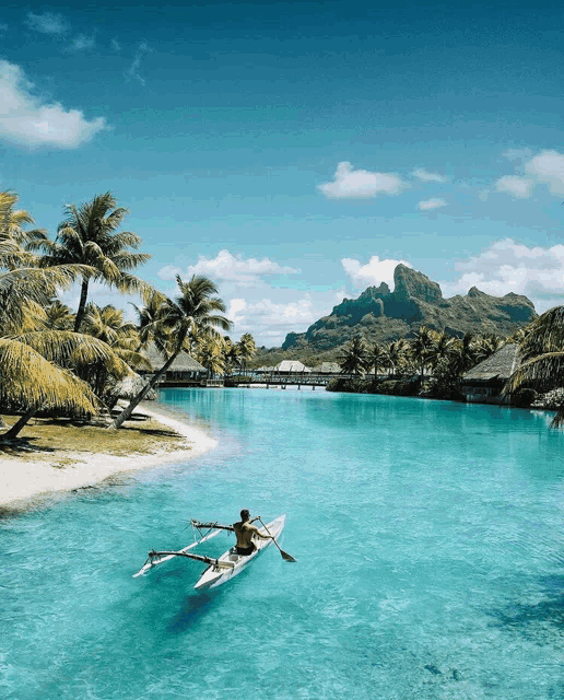 a man in a kayak is paddling in the ocean