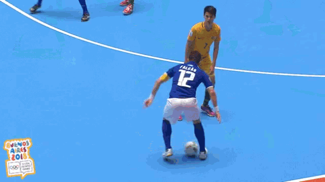 soccer players on a court with a sign that says fifa