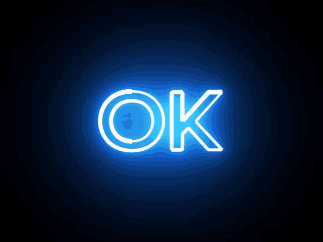 a neon sign that says ok on a black background