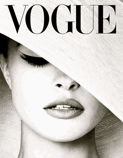 a black and white photo of a woman on the cover of a vogue magazine