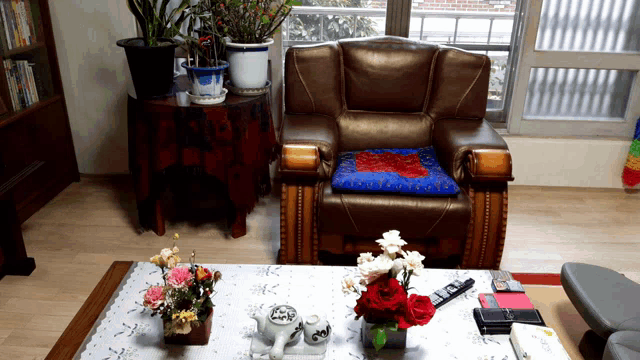 a living room with a chair and a coffee table