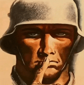 a close up of a soldier 's face with his finger on his mouth